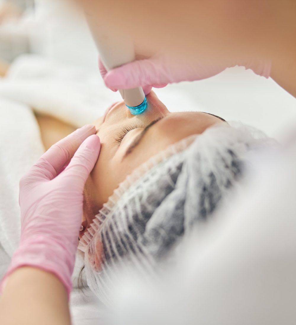 Young Caucasian female undergoing a dermatological procedure